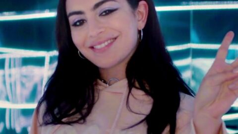Singer Charli XCX smiling at an event