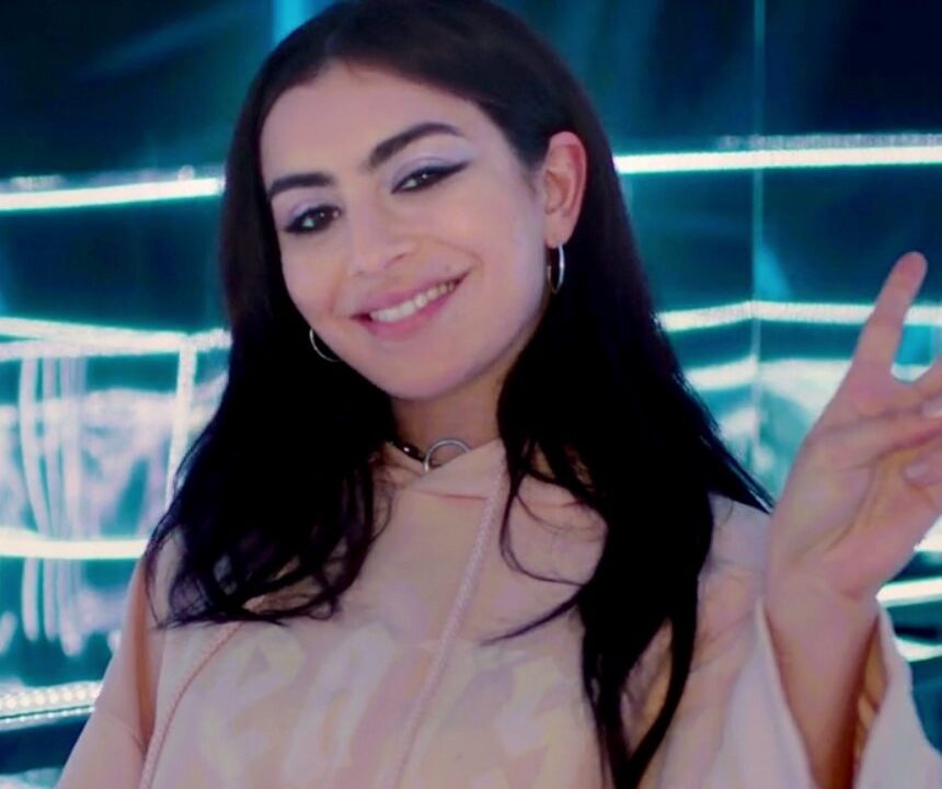 Singer Charli XCX smiling at an event