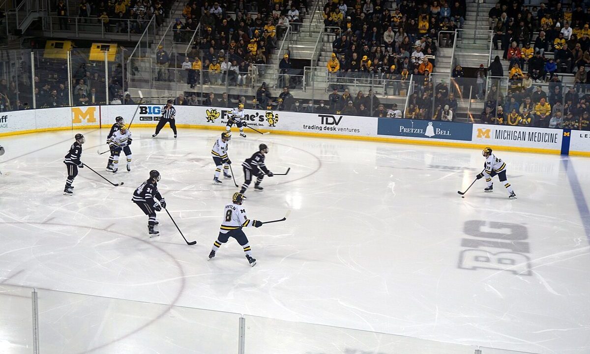 Ice hockey game in progress in a large arena