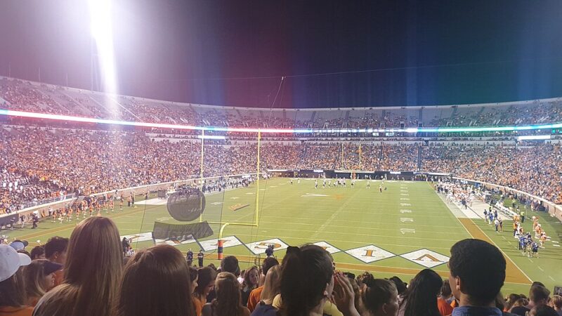 An American football stadium lit up during a night game