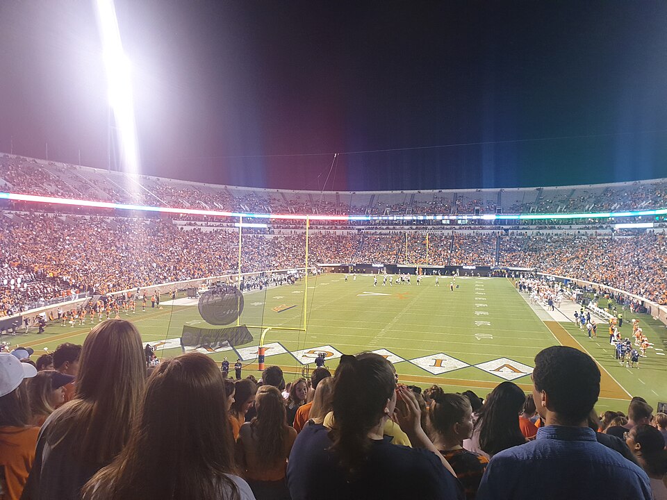 An American football stadium lit up during a night game