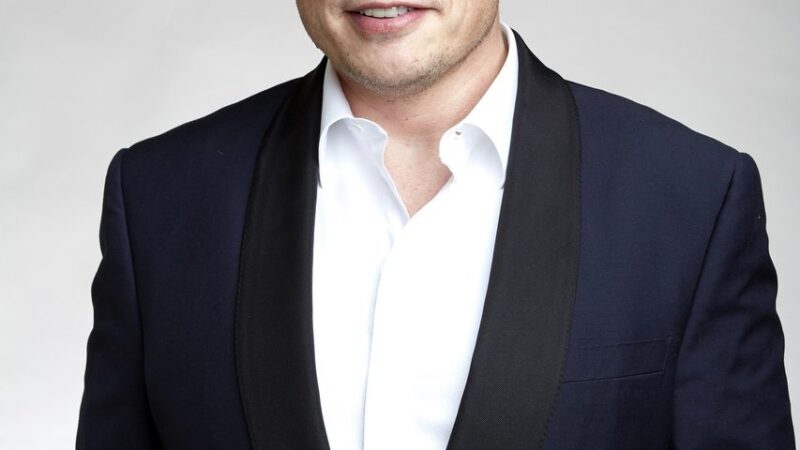 Elon Musk portrait in a dark suit